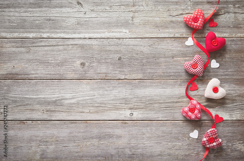 Valentines day background with handmade  textile hearts