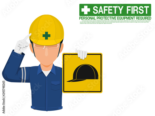 Industrial worker is presenting helmet sign