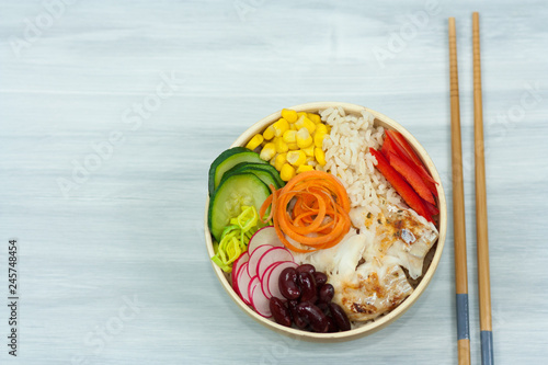 Bowl of vegetables, rice and fish. Healthy food concept.