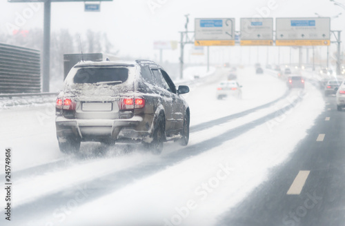 Highway with a lot o snow after a blizzard. dangerous driving. Car on a winter road © Mak