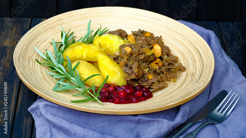 Lapland food sauteed reindeer meat, potatoes and lingonberry jam photo