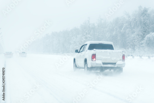 city traffic car road winter snow. road with a sound barrier. white pickup