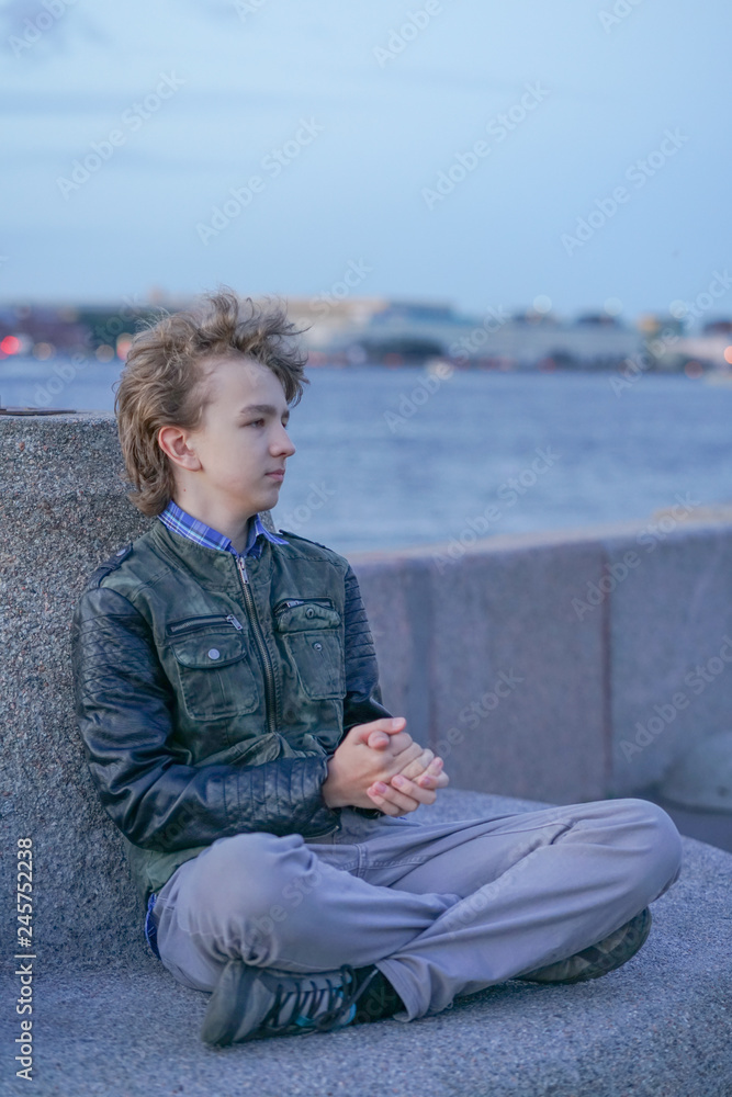 sad lonely boy in the park sitting unhappy sad lonely boy in the park sitting unhappy