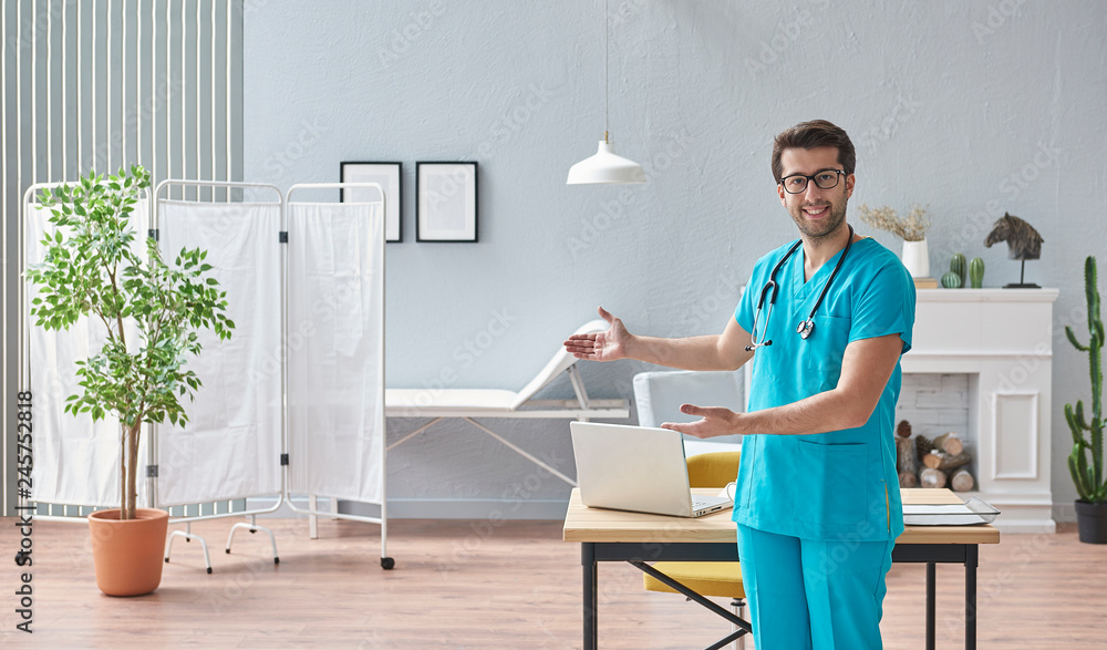 Modern and confident doctor is in the his own office, close up doctor and grey interior modern health center, office or clinic style. Modern and confident doctor is in the his own office, close up doctor and grey interior modern health center, office or clinic style.