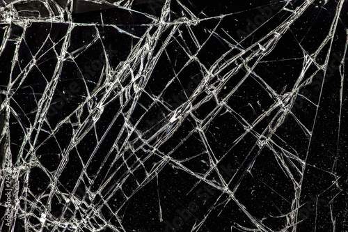 white cracked glass with dust on black background  texture
