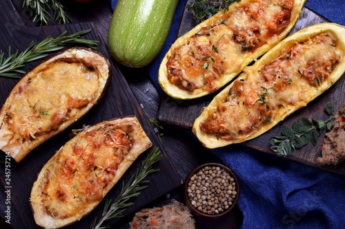 Stuffed eggplant and zucchini halves roasted with cheese 