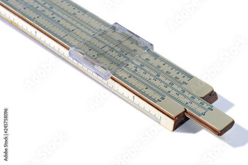 Old slide rule isolated on white background. Vintage logarithmic ruler
