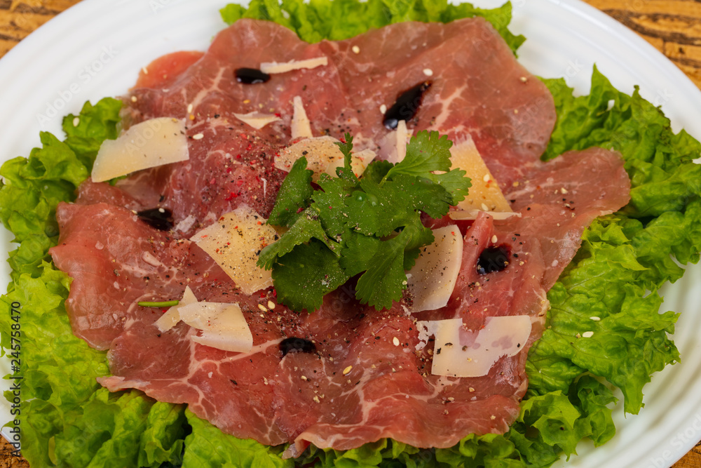 Beef carpaccio with parmesan cheese Beef carpaccio with parmesan cheese