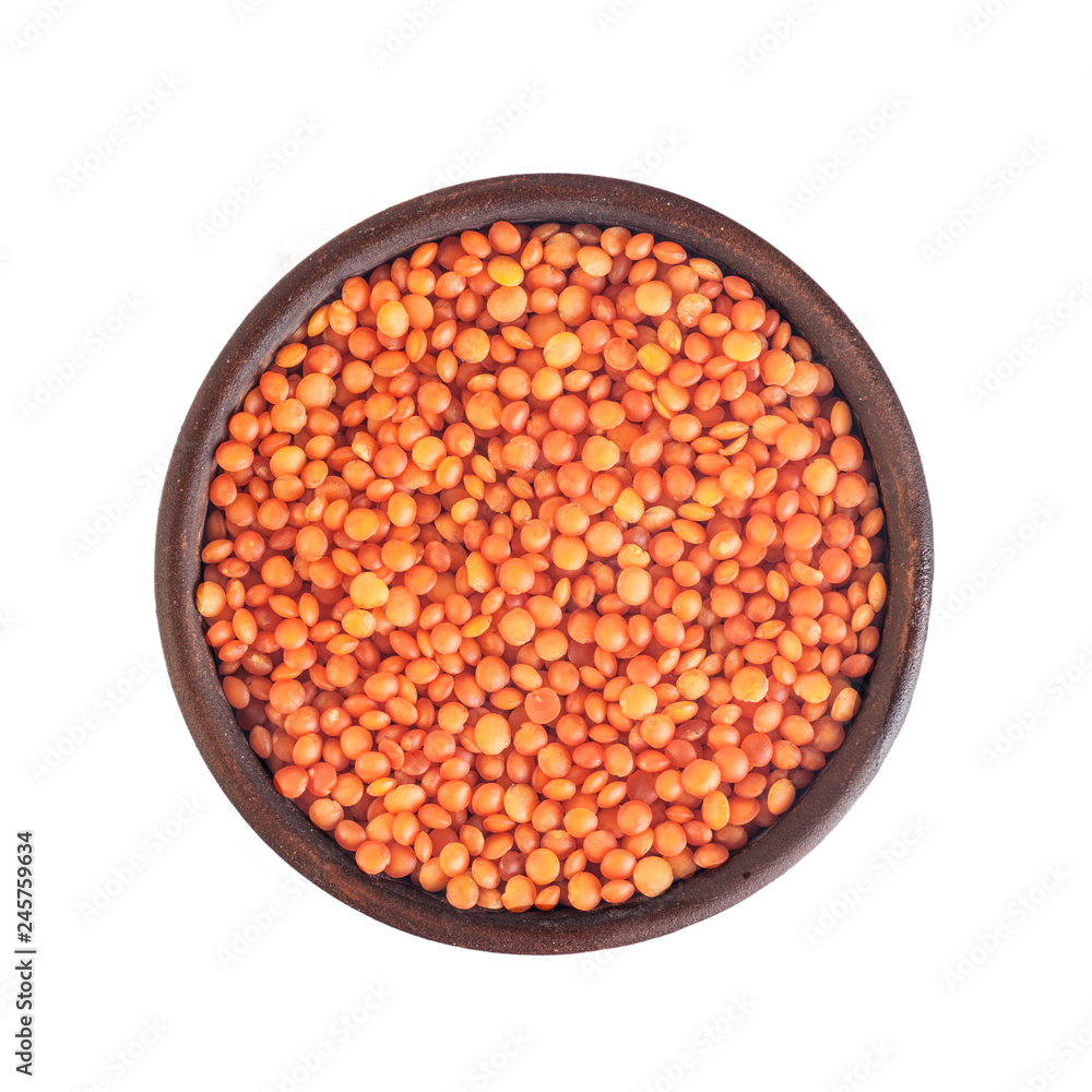 red lentils in a clay brown plate, top view, isolated on white background red lentils in a clay brown plate, top view, isolated on white background