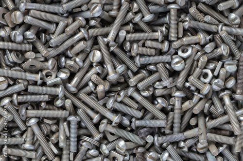 background texture set of galvanized bolts of different sizes and nuts