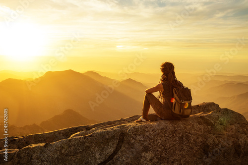 Hiker meets the sunset on the Moro rock in Sequoia national park, California, USA.