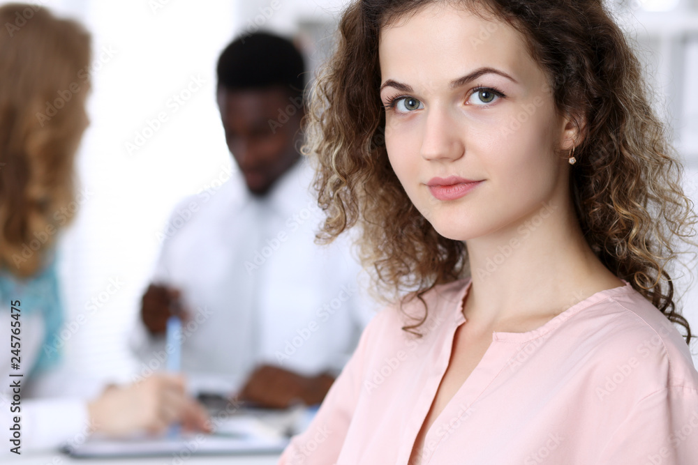 Business woman at meeting in office, colored in white. Multi ethnic business people group Business woman at meeting in office, colored in white. Multi ethnic business people group