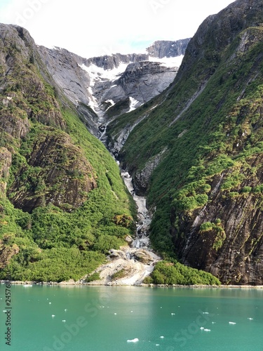 Fototapeta Naklejka Na Ścianę i Meble -  Waterfall in mountains of Alaska Inside Passage