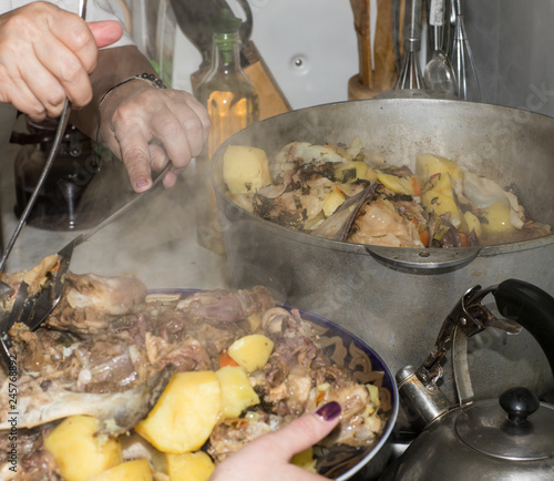 Kazakh meat dish of lamb.Sliced Mutton with bone photo