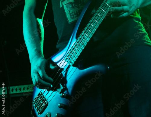 Musician playing guitar in a nightclub