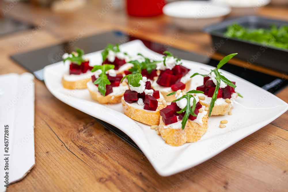 bruschetta with cheese and beetroot on a white plate bruschetta with cheese and beetroot on a white plate