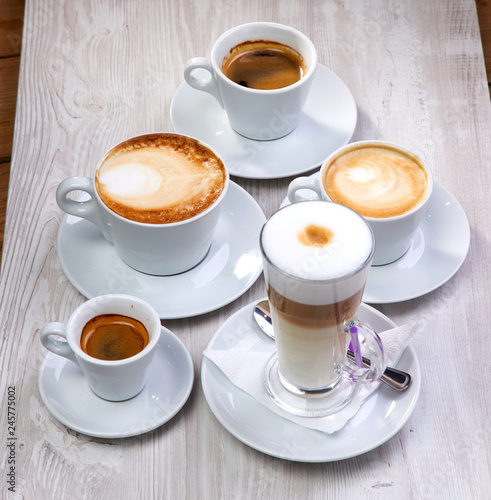 set of coffee drinks on the white wooden background