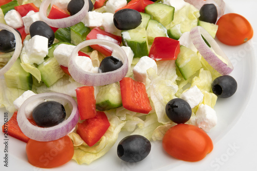 restaurant menu. vegetarian cuisine. Close-up greek salad on a white plate