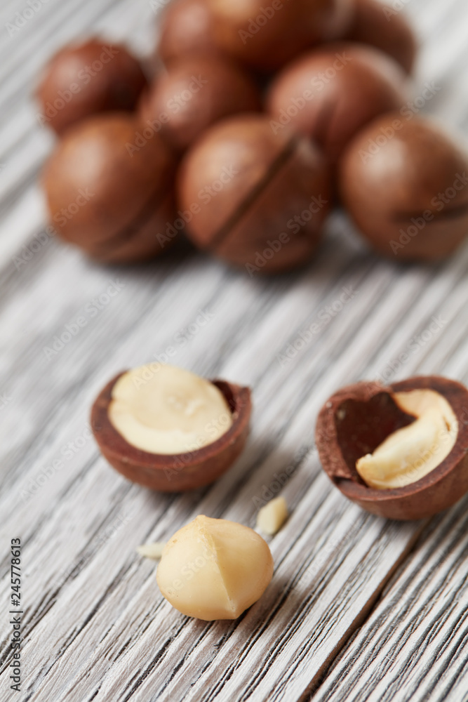 ripe macadamia nuts on a wooden table ripe macadamia nuts on a wooden table