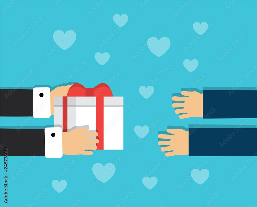 One pair of hands holds a gift box with a bow and other hands want to accept a gift
One pair of hands holds a gift box with a bow and other hands want to accept a gift