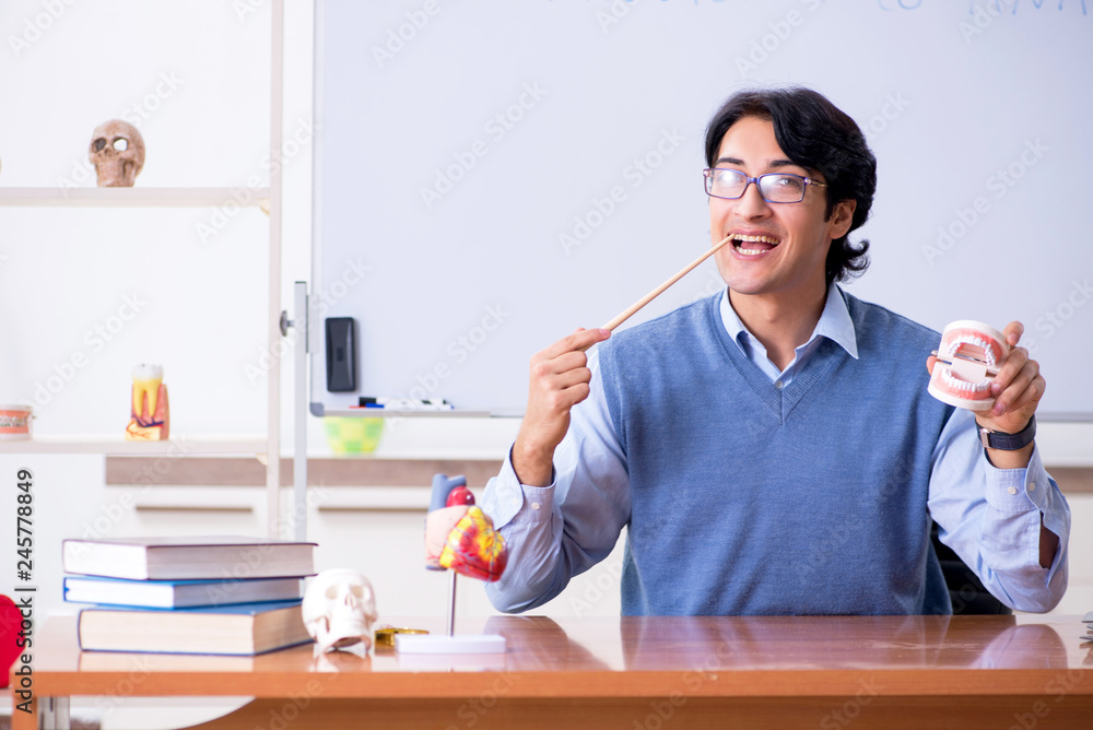Young lecturer teacher teaching anatomy Young lecturer teacher teaching anatomy