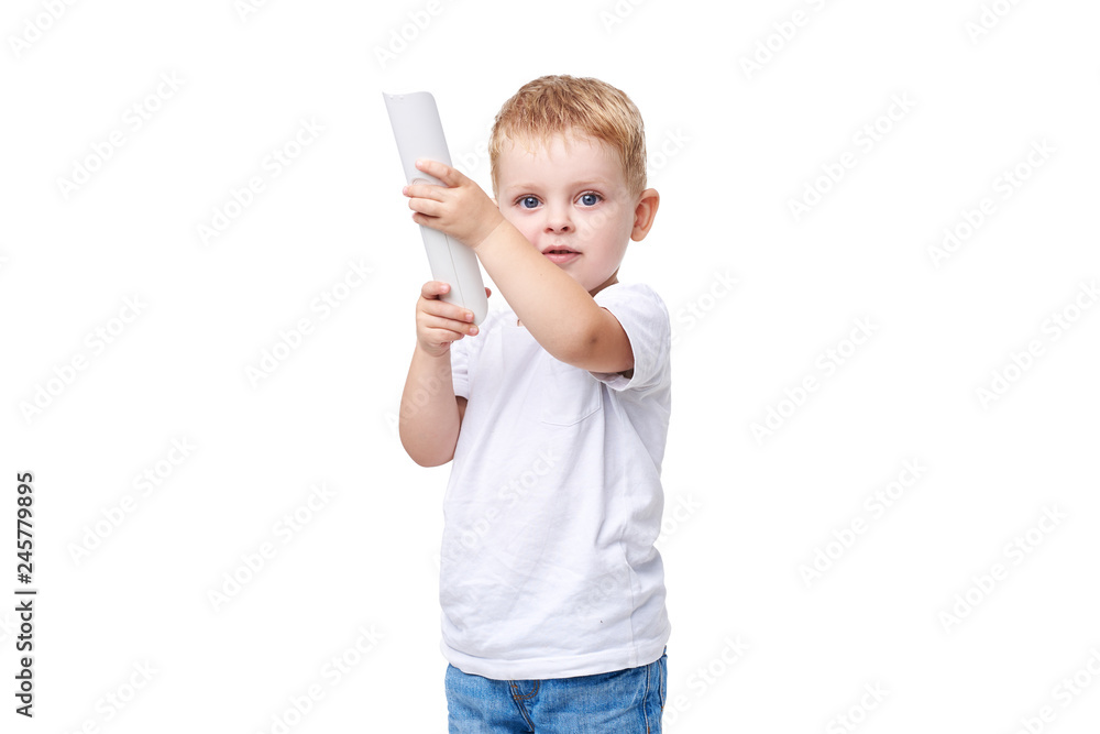Small blond boy in white clothes holding TV remote control on white isolated background Small blond boy in white clothes holding TV remote control on white isolated background