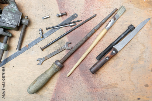 old working tools on painted wooden rustic background