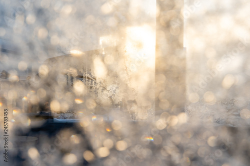 Closeup Photo of Blurred Hoarfrost on Window on a Sunny Winter Day - Abstract Background