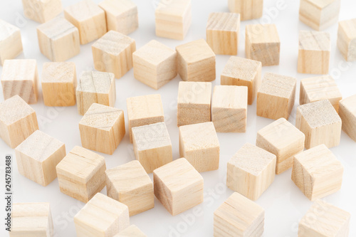 wooden blocks arranged randomly on white background