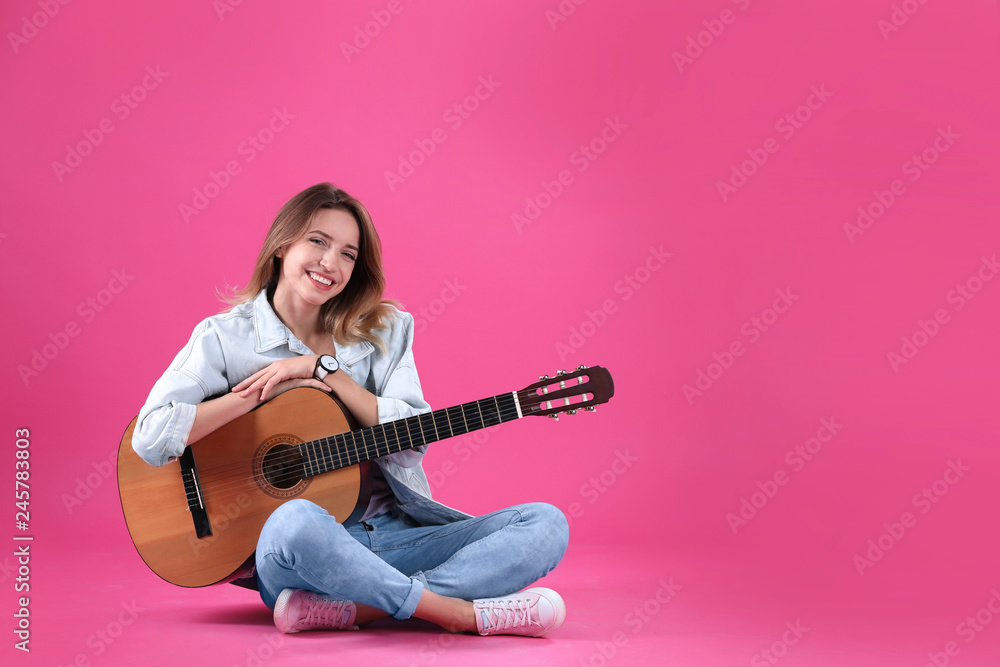 Young woman with acoustic guitar on color background. Space for text Young woman with acoustic guitar on color background. Space for text