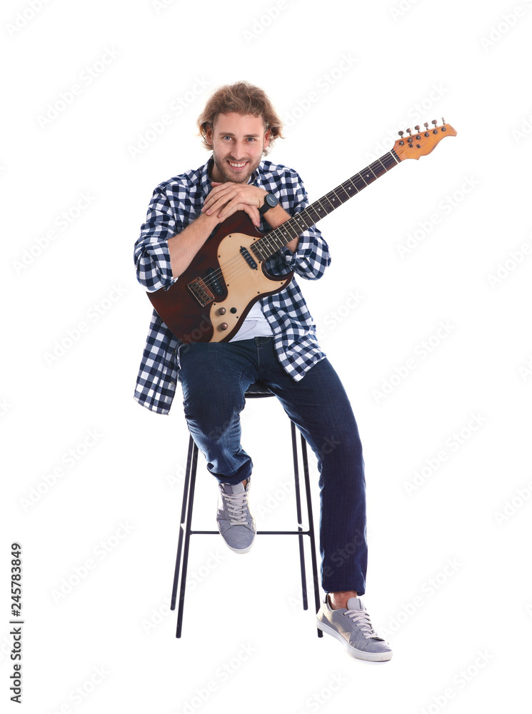 Fototapeta premium Young man with electric guitar on white background