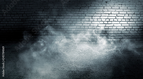 Background of empty dark room with brick walls, illuminated by neon lights with laser beams, smoke