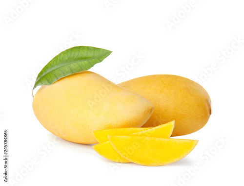 Fresh juicy mango and leaf isolated on white