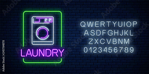 Neon glowing laundry signboard with alphabet. Illuminated self-service washhouse sign