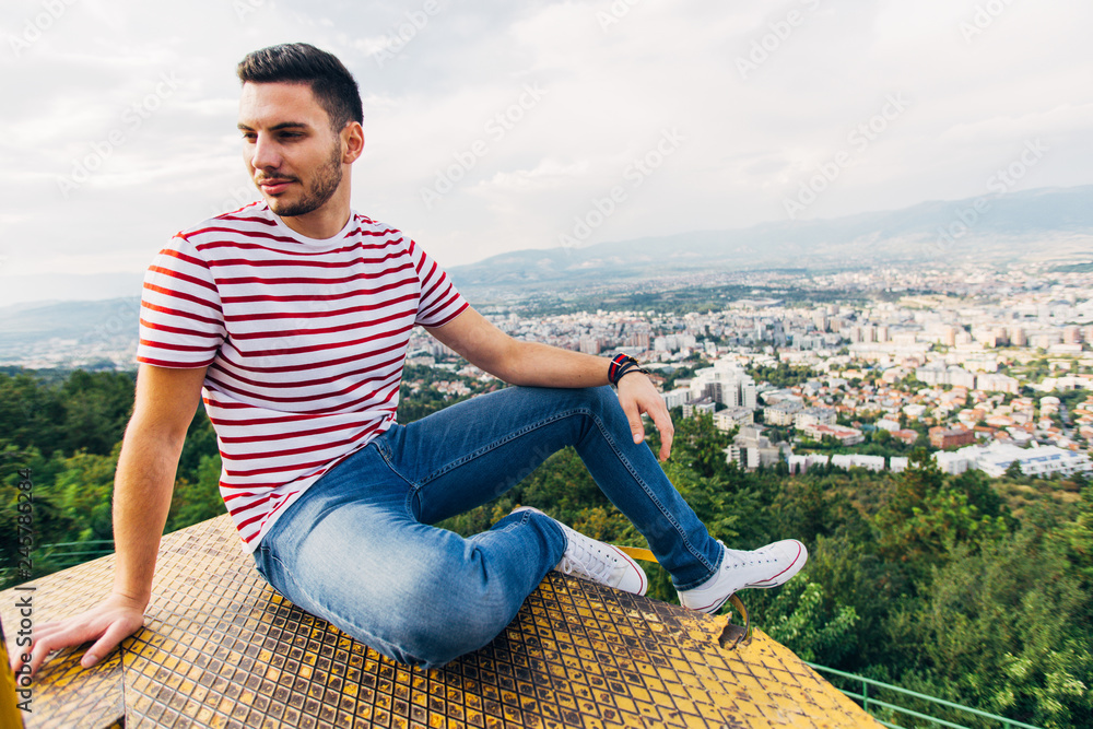 Man sitting on a metal construction