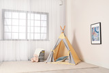 Cozy child room interior with play tent near window