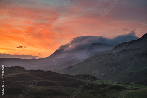 Beautifuk vibrant landscape image of mountains around Cregennen Lakes in Snowdonia on Winter sunrise morning