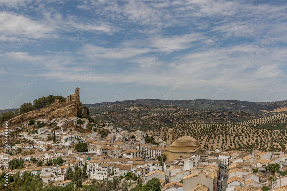 A view of the church and town of Montefrio, Spain in summertime
