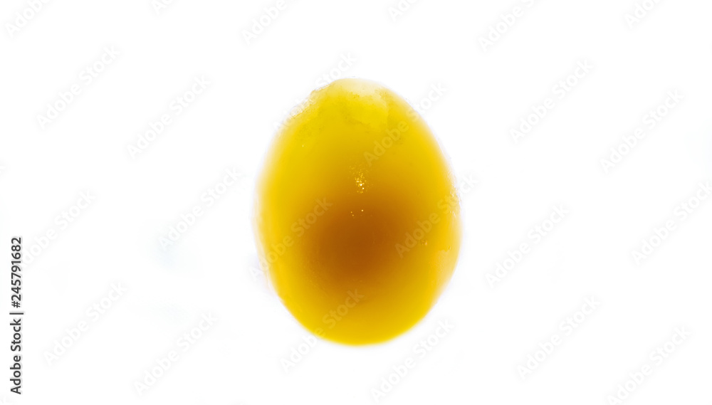 frozen yolk in broken and peeled egg on an isolated white background - obrazy, fototapety, plakaty 