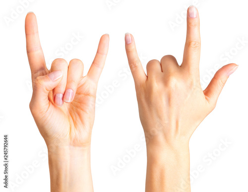 Set of women's hands showing rock n roll sign or giving the devil horns gesture