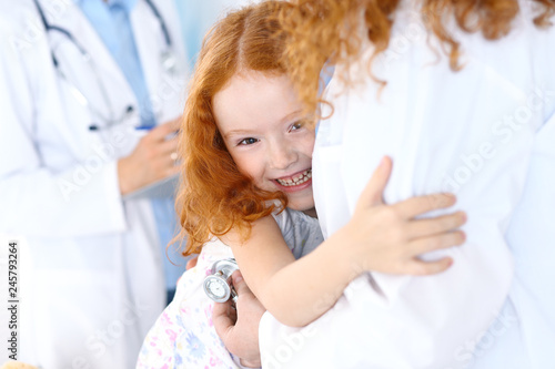 Doctor examining a little girl with stethoscope.Medicine and healthcare concept