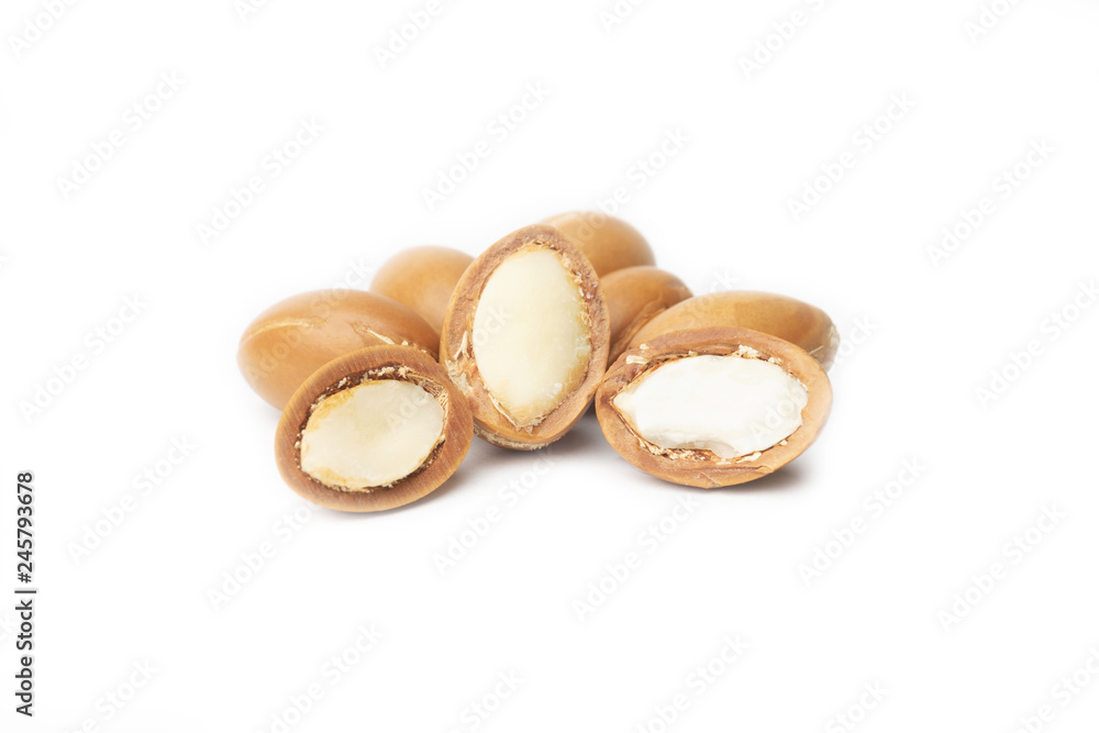 ARGAN SEEDS isolated on a white background. Argan oil and argan nuts concept ARGAN SEEDS isolated on a white background. Argan oil and argan nuts concept