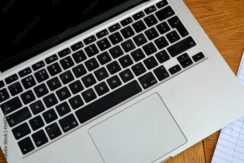 Flat lay style image of modern laptop computer keyboard. 