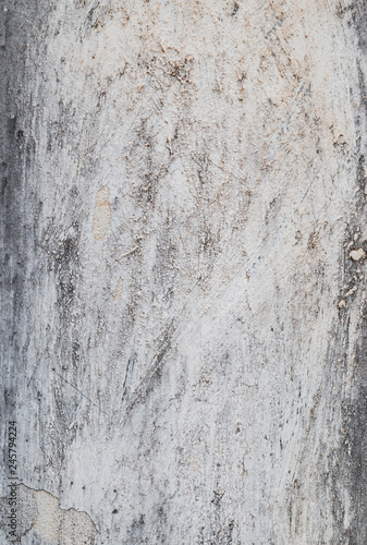 High resolution full frame background of a rough, weathered, damaged and dirty plastered light gray wall.