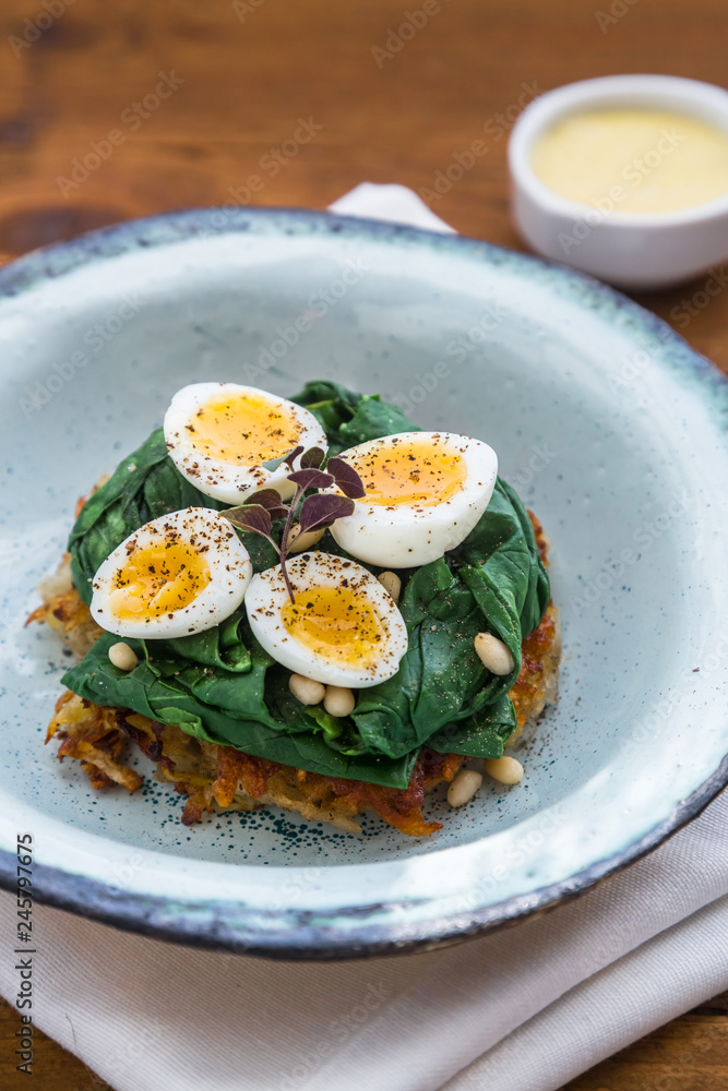 Quail Eggs florentine with spinach and rosti Quail Eggs florentine with spinach and rosti