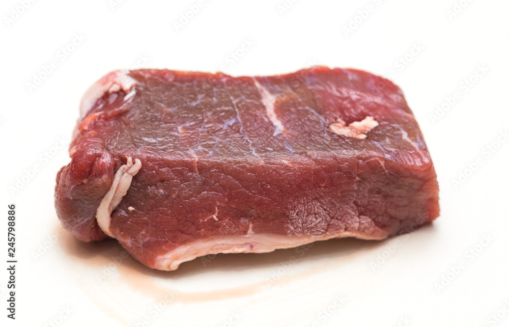 slices of raw meat on a white background