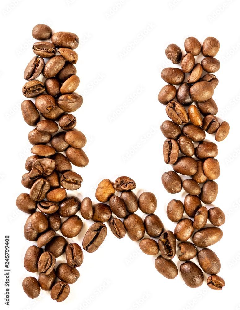 W letter made from coffee beans isolated on white background W letter made from coffee beans isolated on white background