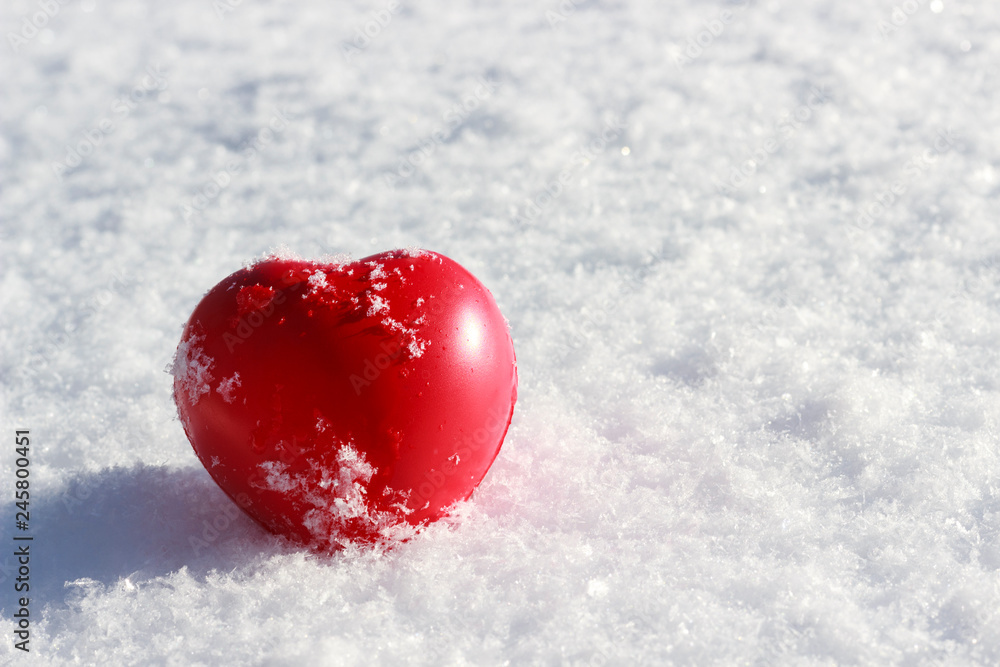 symbol of love, heart in the snow close up symbol of love, heart in the snow close up