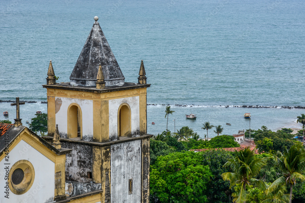 The architecture of the historic city of Olinda in Pernambuco, Brazil showcasing the Se Church dated from the 17th century in Baroque style at sunset.