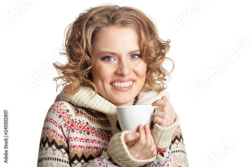 Portrait of beautiful woman holding cup on white background